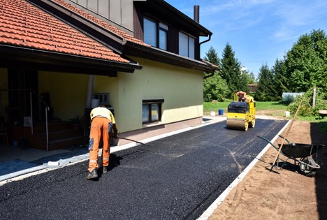 Asphalt driveway in front of a home