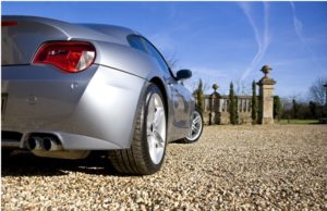 Car on chip seal driveway