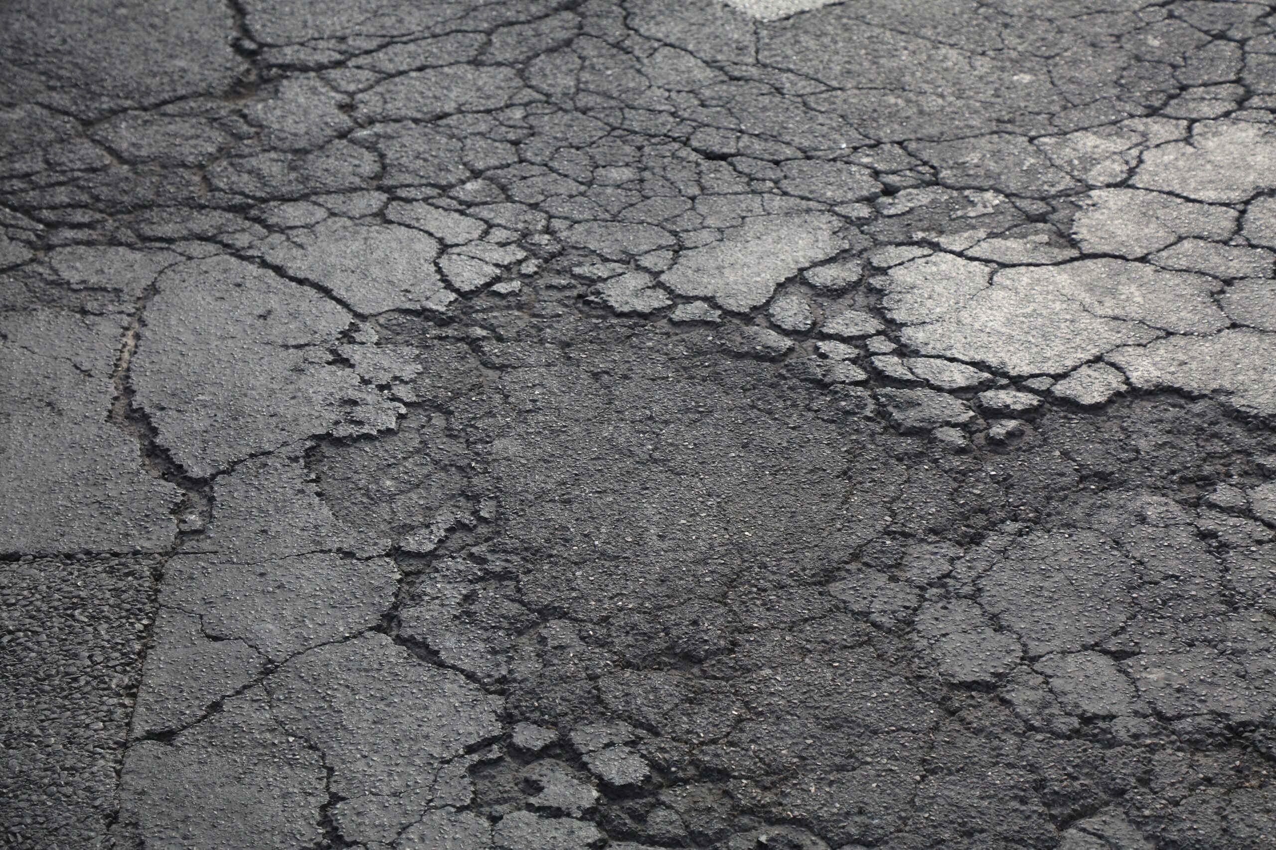 picture of pavement cracked and weathered